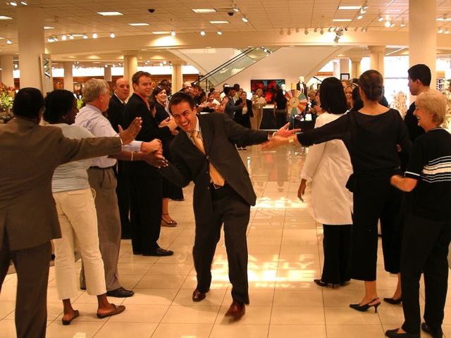 Associates line up on both sides to congratulate outstanding sales associates at Nordstrom. Photo by J. Jeff Kober.